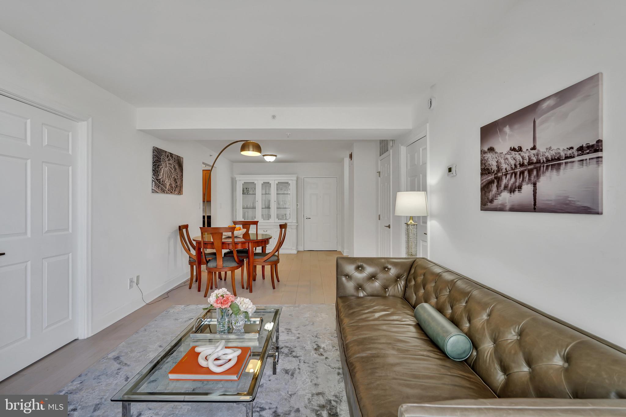 3401 38th Street Northwest, Unit 407 Washington, DC 20016 - Photo 16 of 28 a living room with furniture and a dining table