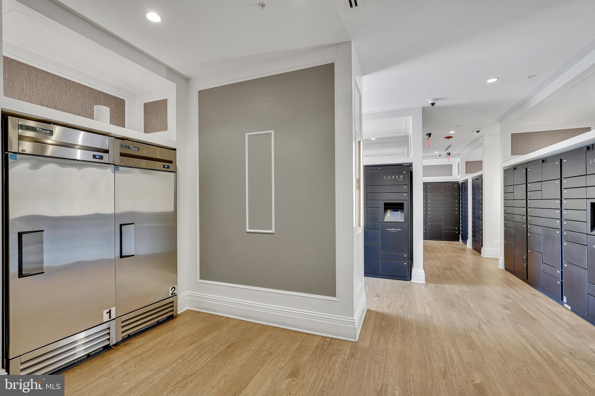 3401 38th Street Northwest, Unit 407 Washington, DC 20016 - Photo 20 of 28 a view of a hallway with wooden floor