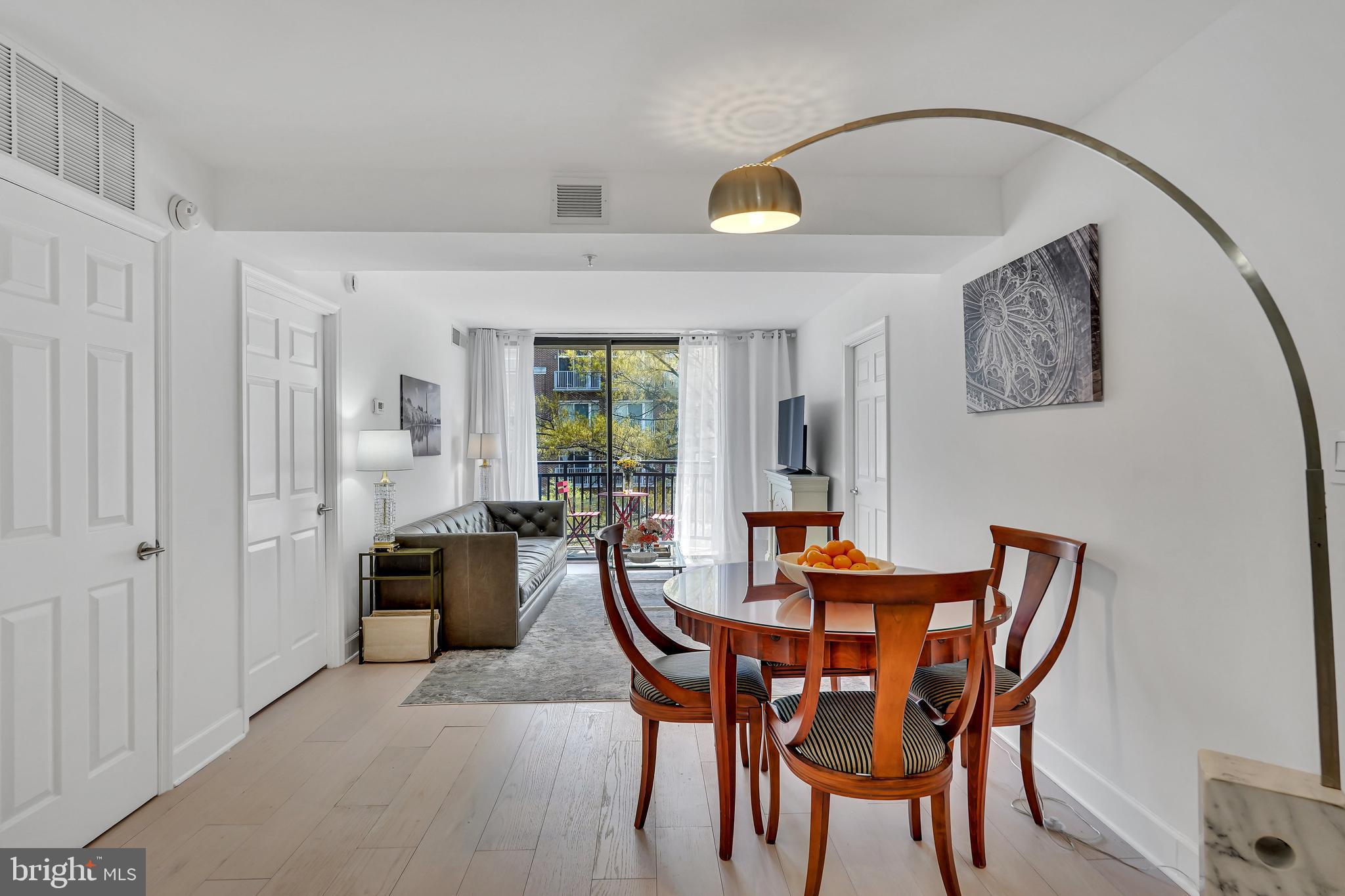 3401 38th Street Northwest, Unit 407 Washington, DC 20016 - Photo 2 of 28 a dining room with furniture and window