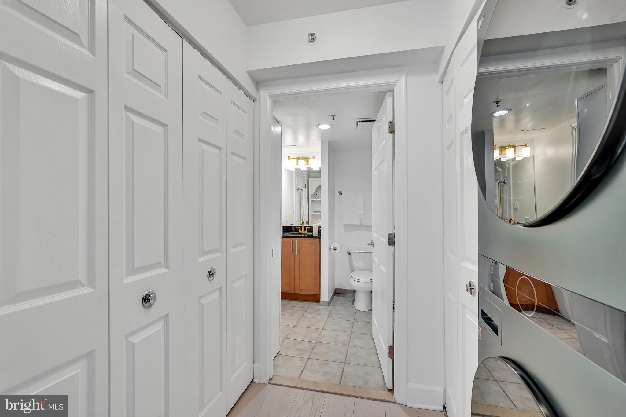 3401 38th Street Northwest, Unit 407 Washington, DC 20016 - Photo 9 of 28 a view of a hallway with wooden floor and entryway