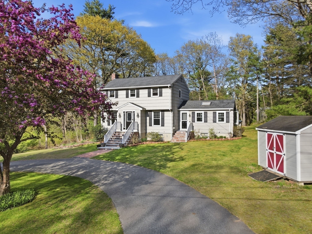 3 Fairway Drive Canton, MA 02021 - Photo 2 of 34 a front view of a house with a garden