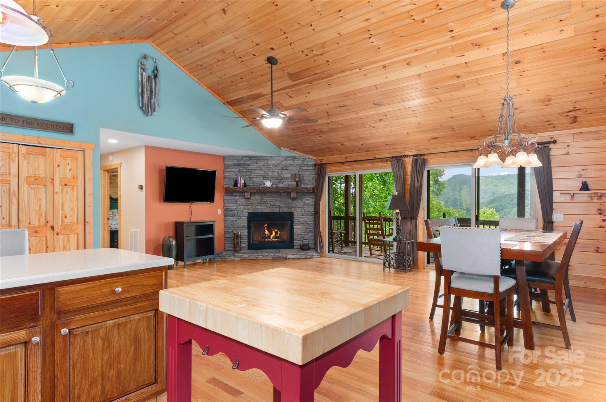 314 Prosperity Ridge Waynesville, NC 28785 - Photo 11 of 48 a kitchen with a table chairs and a fireplace