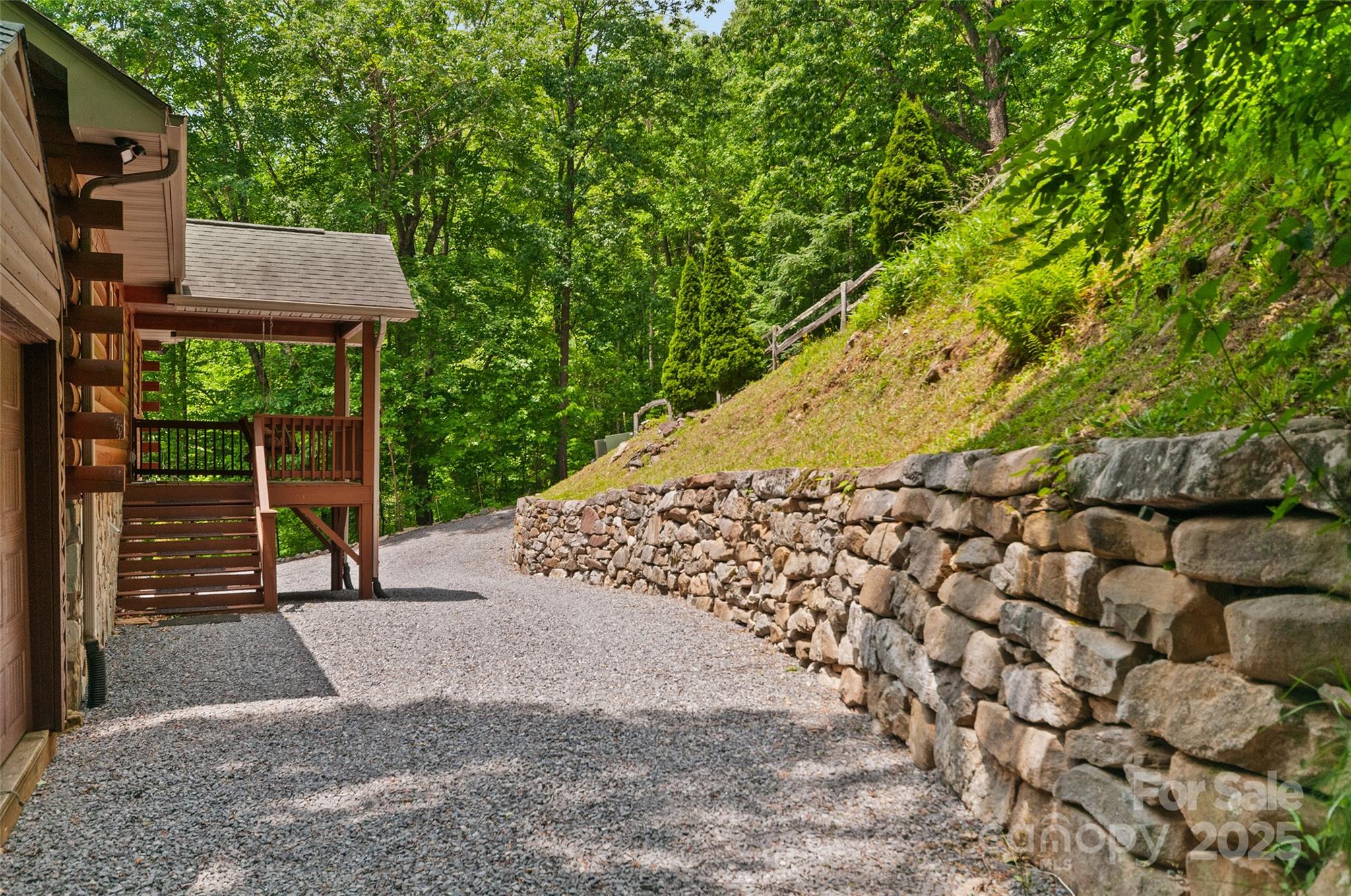 314 Prosperity Ridge Waynesville, NC 28785 - Photo 35 of 48 a view of a bench in front of a house