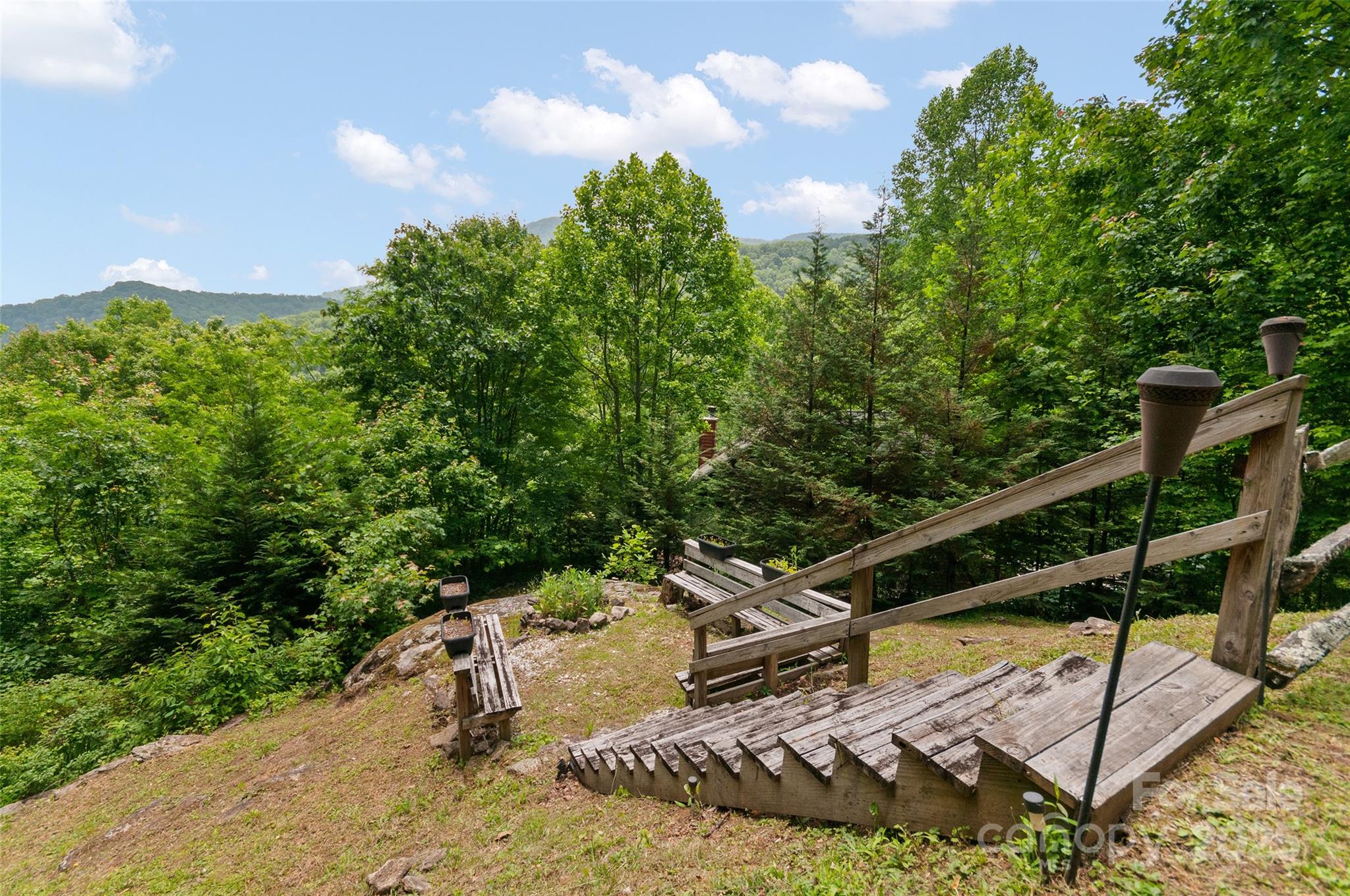 314 Prosperity Ridge Waynesville, NC 28785 - Photo 37 of 48 a view of a wooden bridge