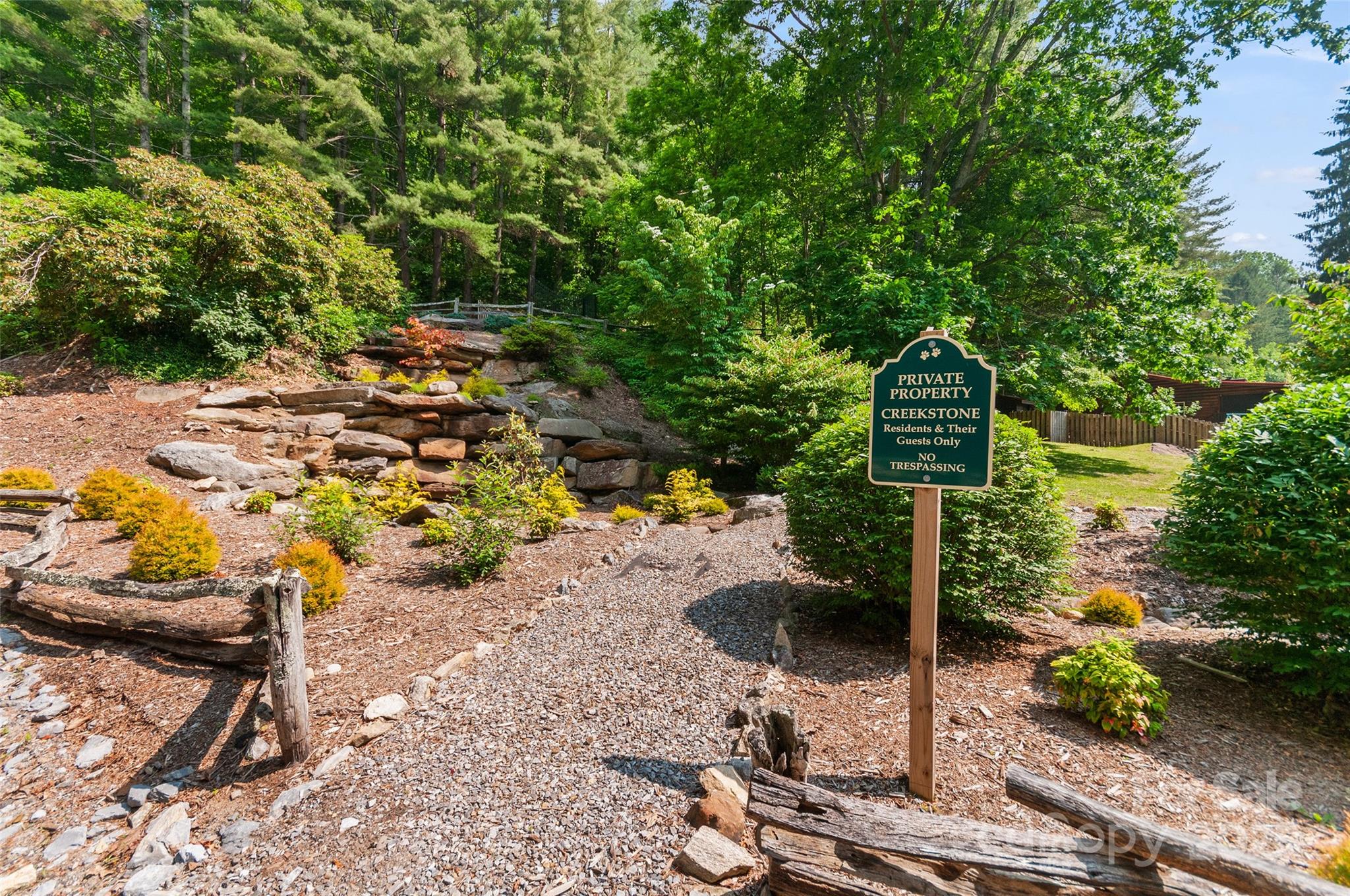 314 Prosperity Ridge Waynesville, NC 28785 - Photo 47 of 48 a backyard of a house with table and chairs