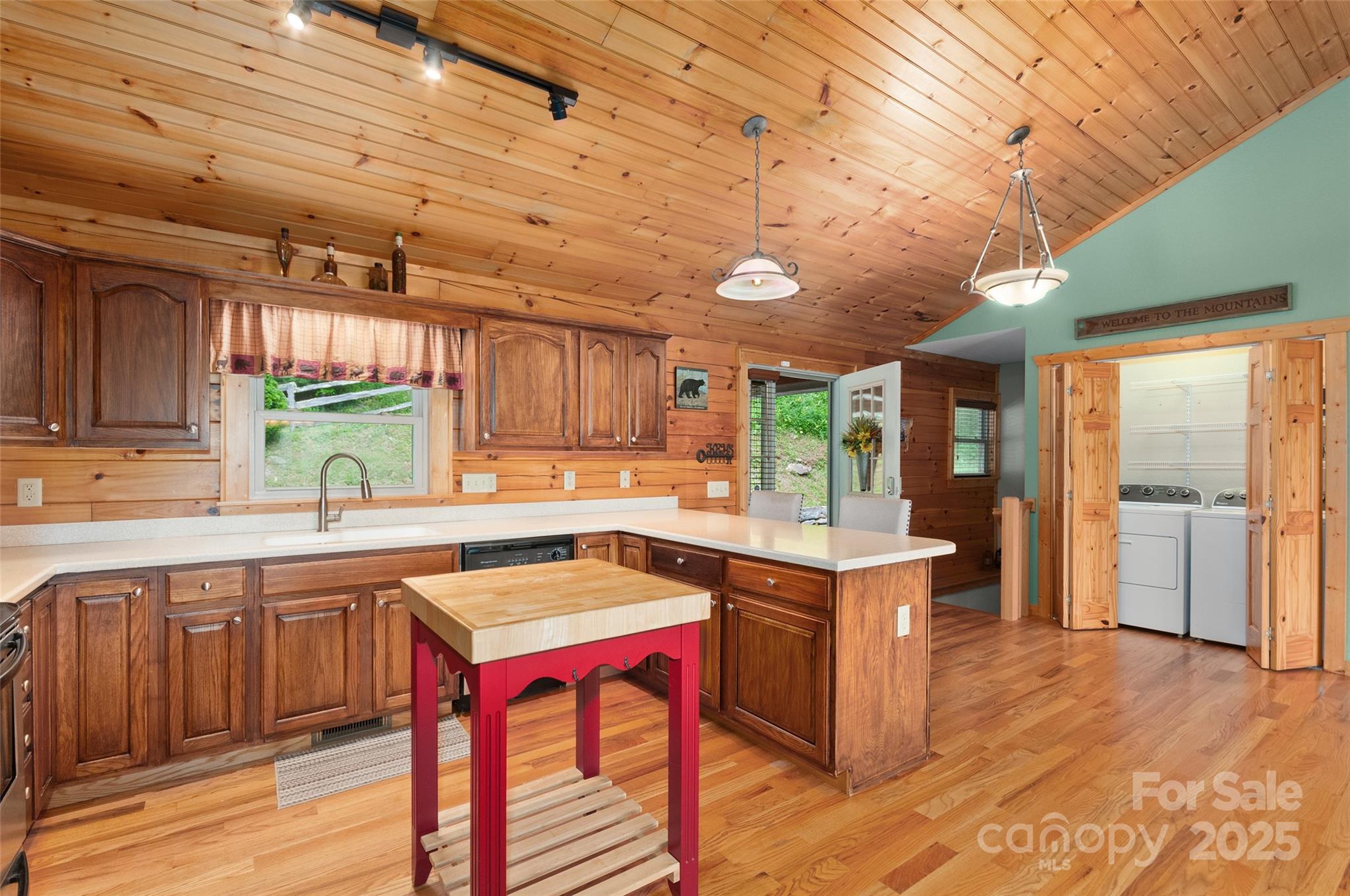 314 Prosperity Ridge Waynesville, NC 28785 - Photo 9 of 48 a kitchen with a stove a refrigerator and a sink