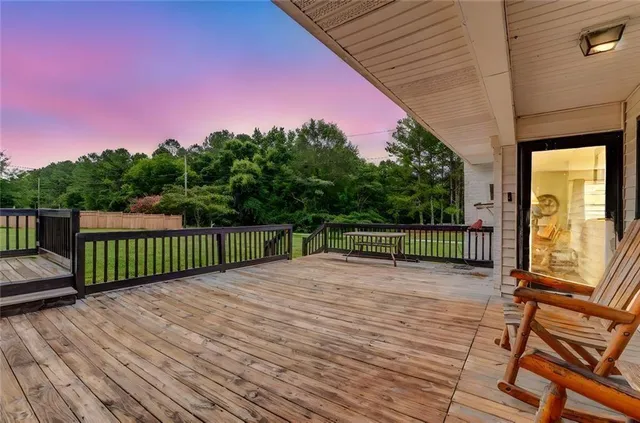 a view of a balcony with wooden floor