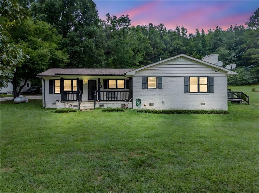 4244 Prior Station Road Cedartown, GA 30125 - Photo 2 of 51 a front view of house with yard and trees in the background