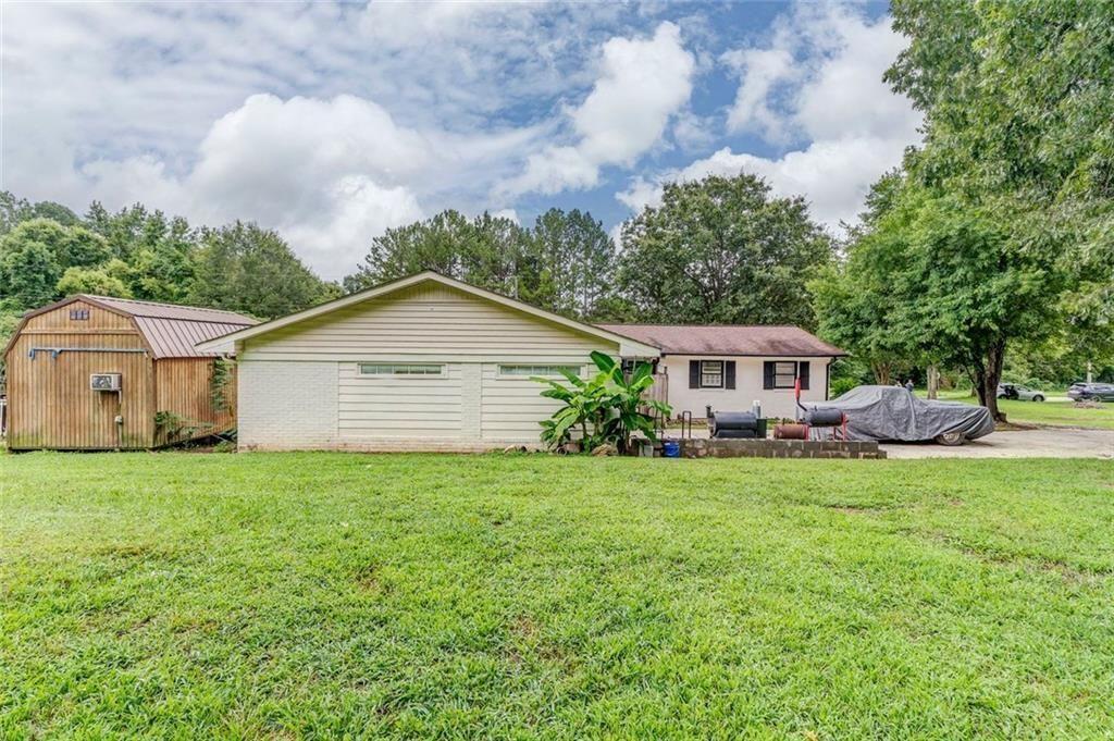 4244 Prior Station Road Cedartown, GA 30125 - Photo 21 of 51 a front view of a house with garden
