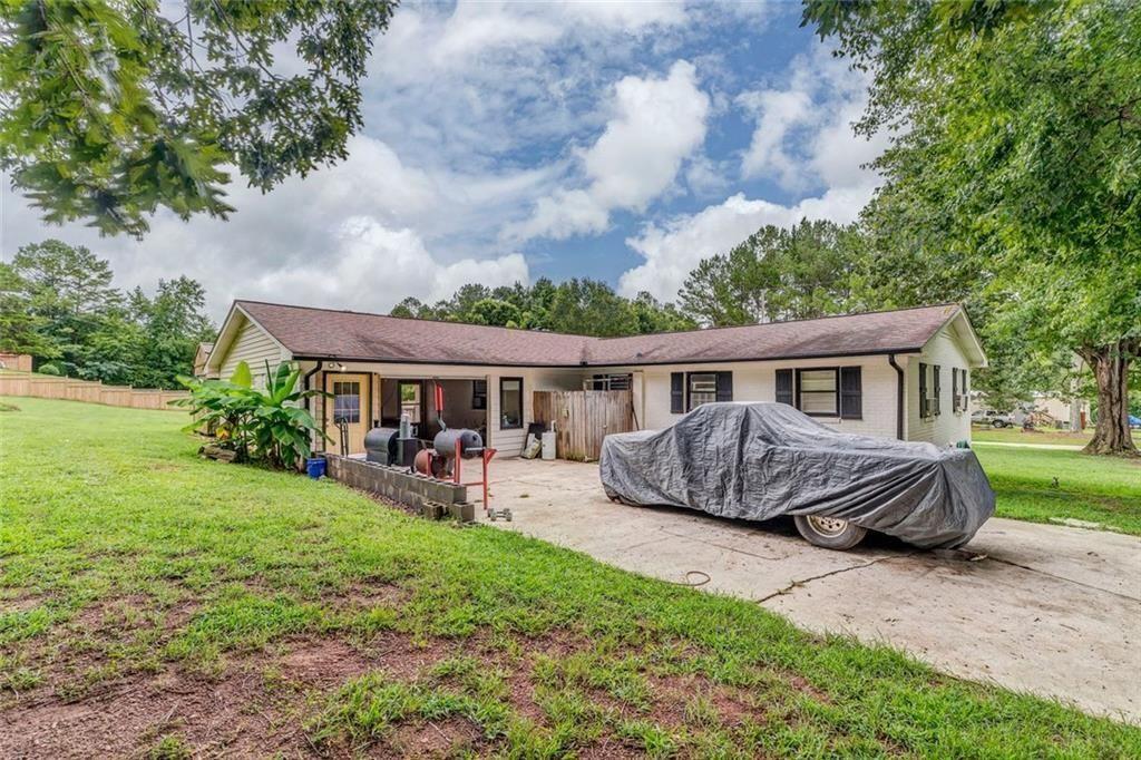 4244 Prior Station Road Cedartown, GA 30125 - Photo 22 of 51 a front view of a house with garden
