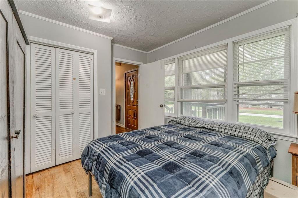 4244 Prior Station Road Cedartown, GA 30125 - Photo 27 of 51 a bedroom with a bed and a window