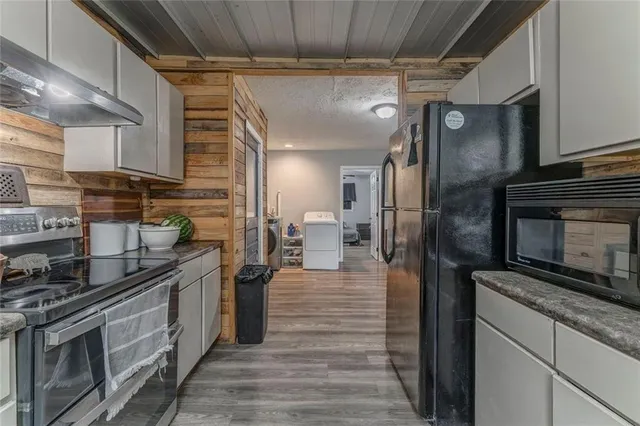 a kitchen with a stove and cabinets