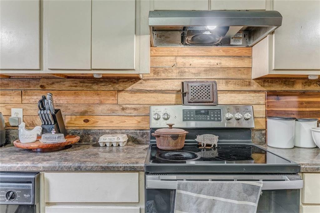 4244 Prior Station Road Cedartown, GA 30125 - Photo 37 of 51 a kitchen with a stove and cabinets