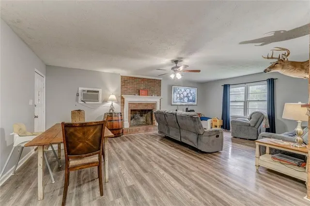 a dining room with furniture and wooden floor