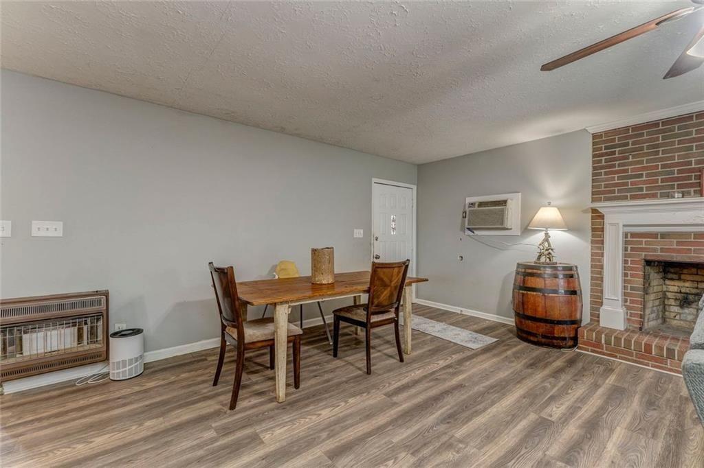 4244 Prior Station Road Cedartown, GA 30125 - Photo 39 of 51 a dining room with furniture and wooden floor