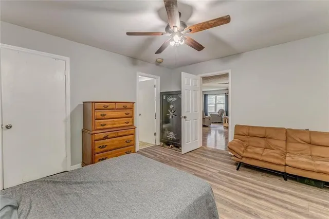 a bathroom with a granite countertop sink a mirror and a shower