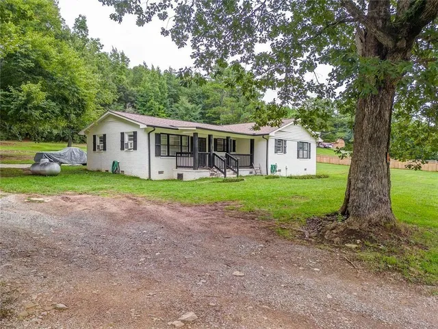 a view of front of house with a yard