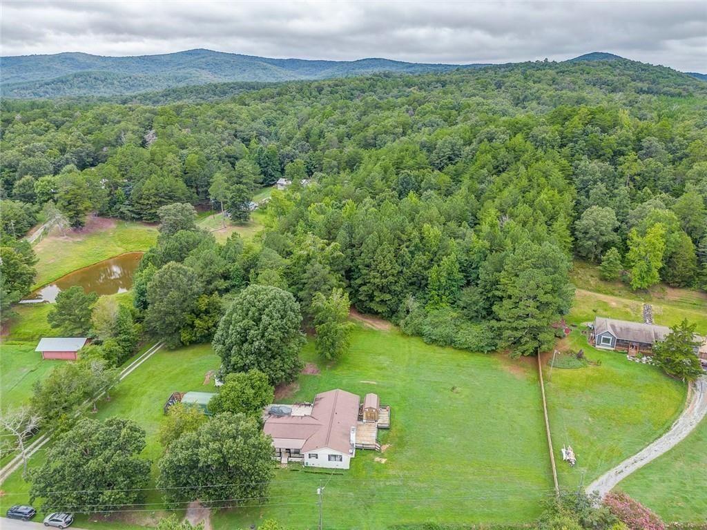 4244 Prior Station Road Cedartown, GA 30125 - Photo 7 of 51 a view of a lush green outdoor space with a lake view and mountain view