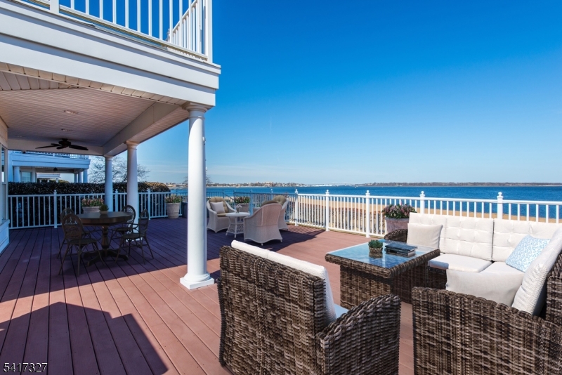 76 Raritan Reach Road South Amboy, NJ 08879 - Photo 15 of 42 a view of a roof deck with a table and chairs