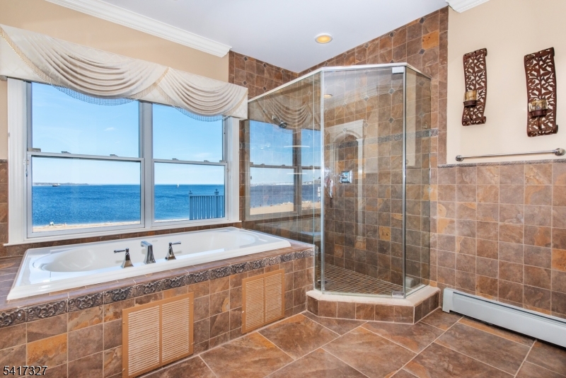 76 Raritan Reach Road South Amboy, NJ 08879 - Photo 23 of 42 a bathroom with a bathtub and a shower