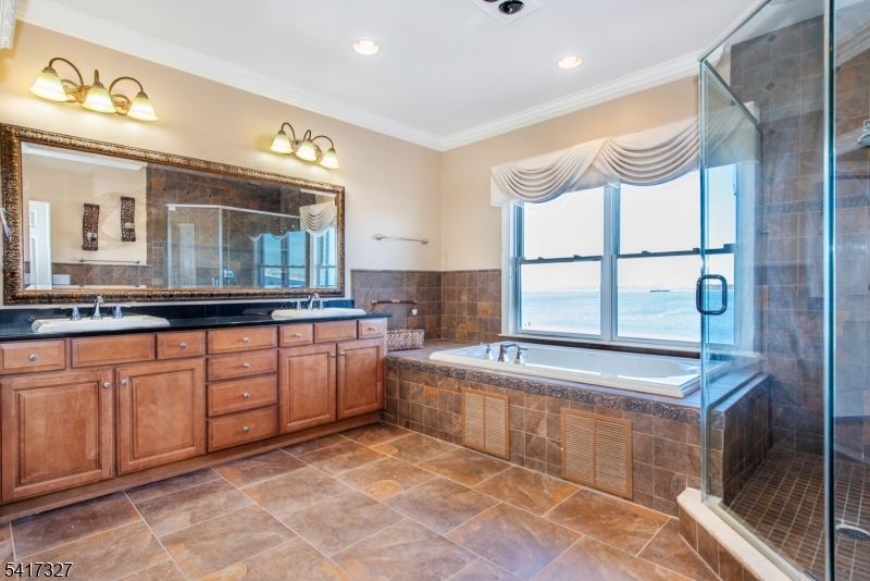 76 Raritan Reach Road South Amboy, NJ 08879 - Photo 24 of 42 a spacious bathroom with a granite countertop sink mirror and bathtub