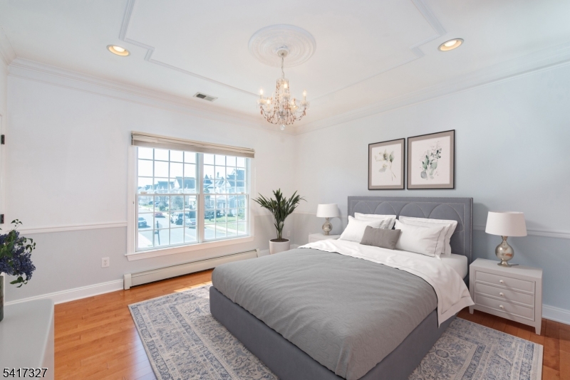 76 Raritan Reach Road South Amboy, NJ 08879 - Photo 25 of 42 a bedroom with a large bed and a window
