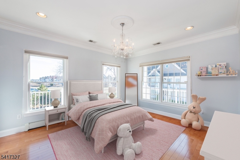 76 Raritan Reach Road South Amboy, NJ 08879 - Photo 27 of 42 a bedroom with a bed and a window