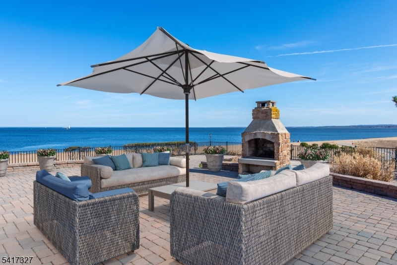 76 Raritan Reach Road South Amboy, NJ 08879 - Photo 31 of 42 a view of a roof deck with couches and umbrella