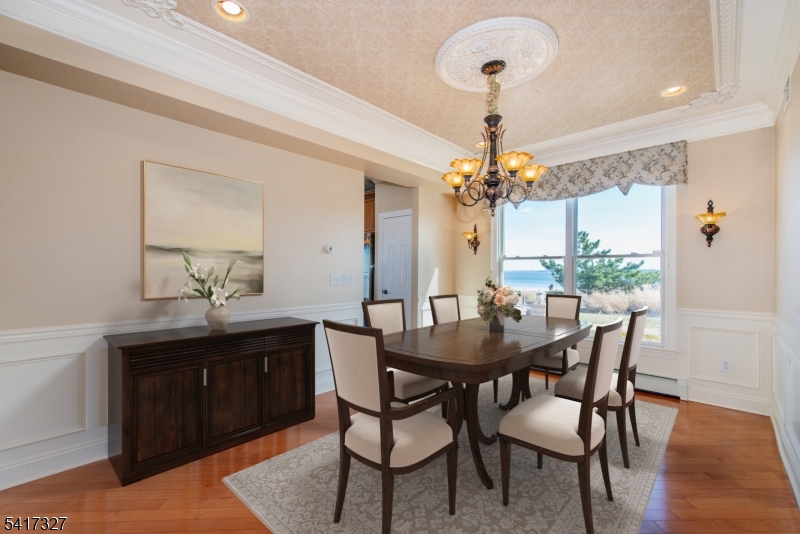 76 Raritan Reach Road South Amboy, NJ 08879 - Photo 7 of 42 a view of a dining room with furniture and chandelier