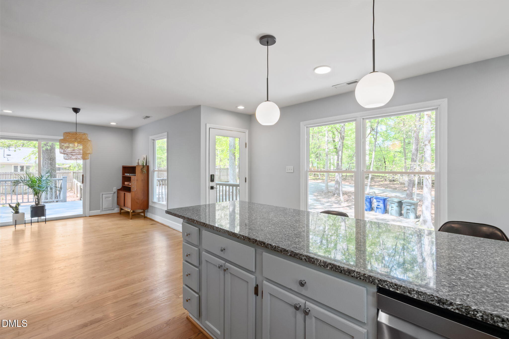 201 Simpson Street, Unit B Carrboro, NC 27510 - Photo 10 of 56 a large kitchen with granite countertop a stove a sink and a large window