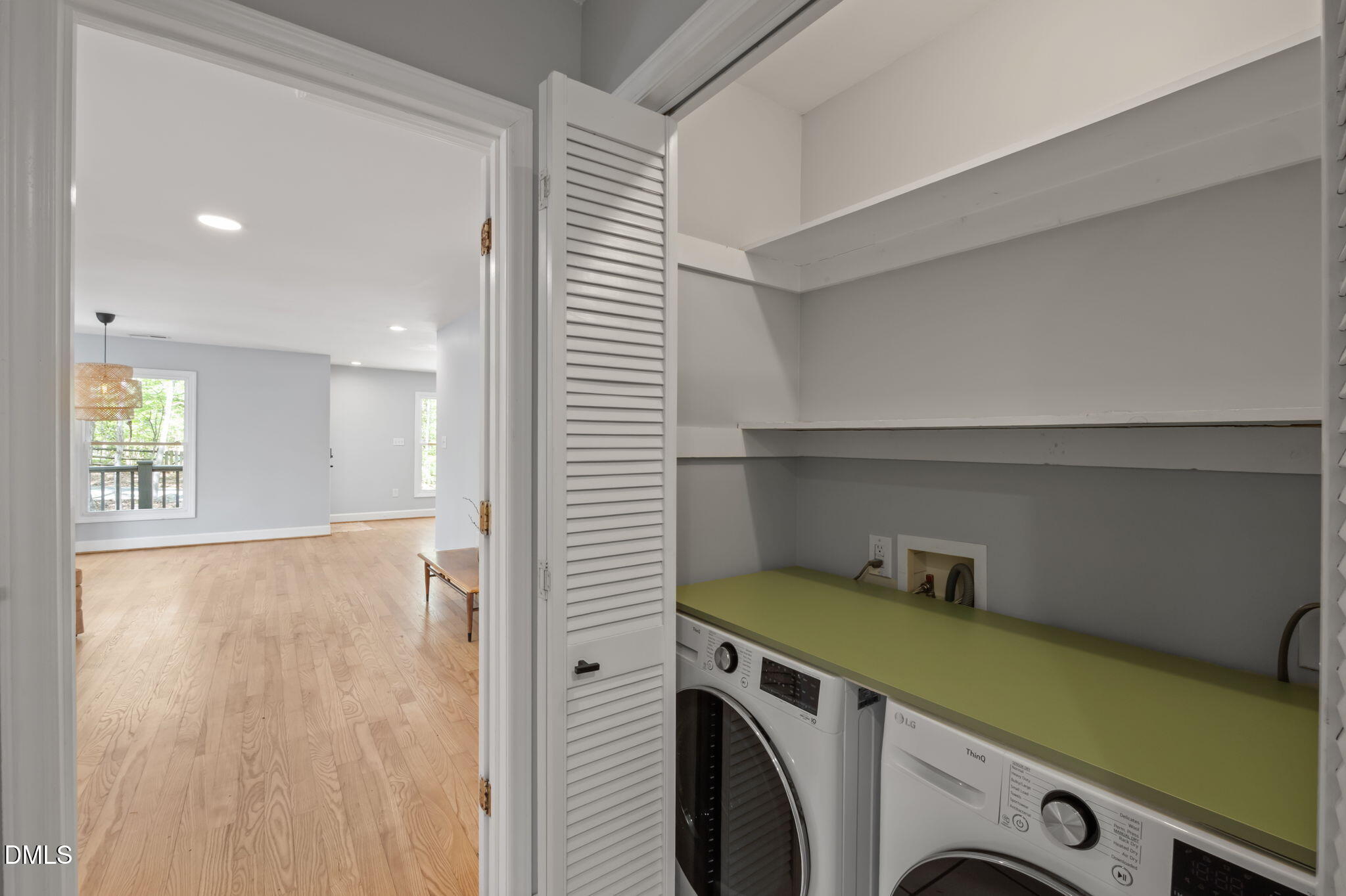 201 Simpson Street, Unit B Carrboro, NC 27510 - Photo 19 of 56 a view of storage and utility room with washer and dryer