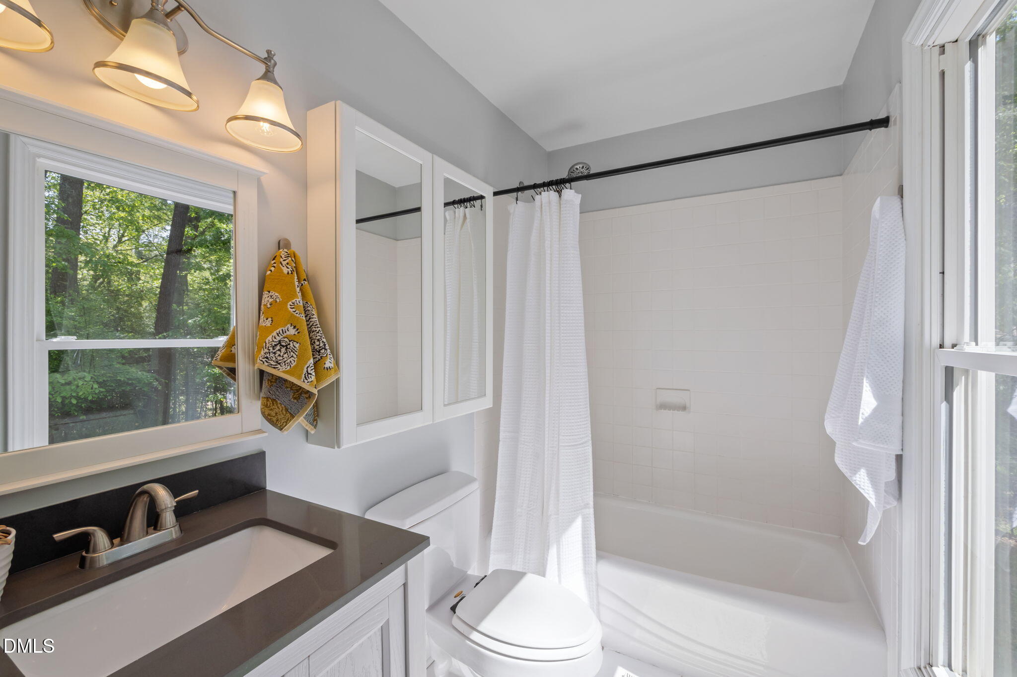 201 Simpson Street, Unit B Carrboro, NC 27510 - Photo 22 of 56 a bathroom with a tub and a shower