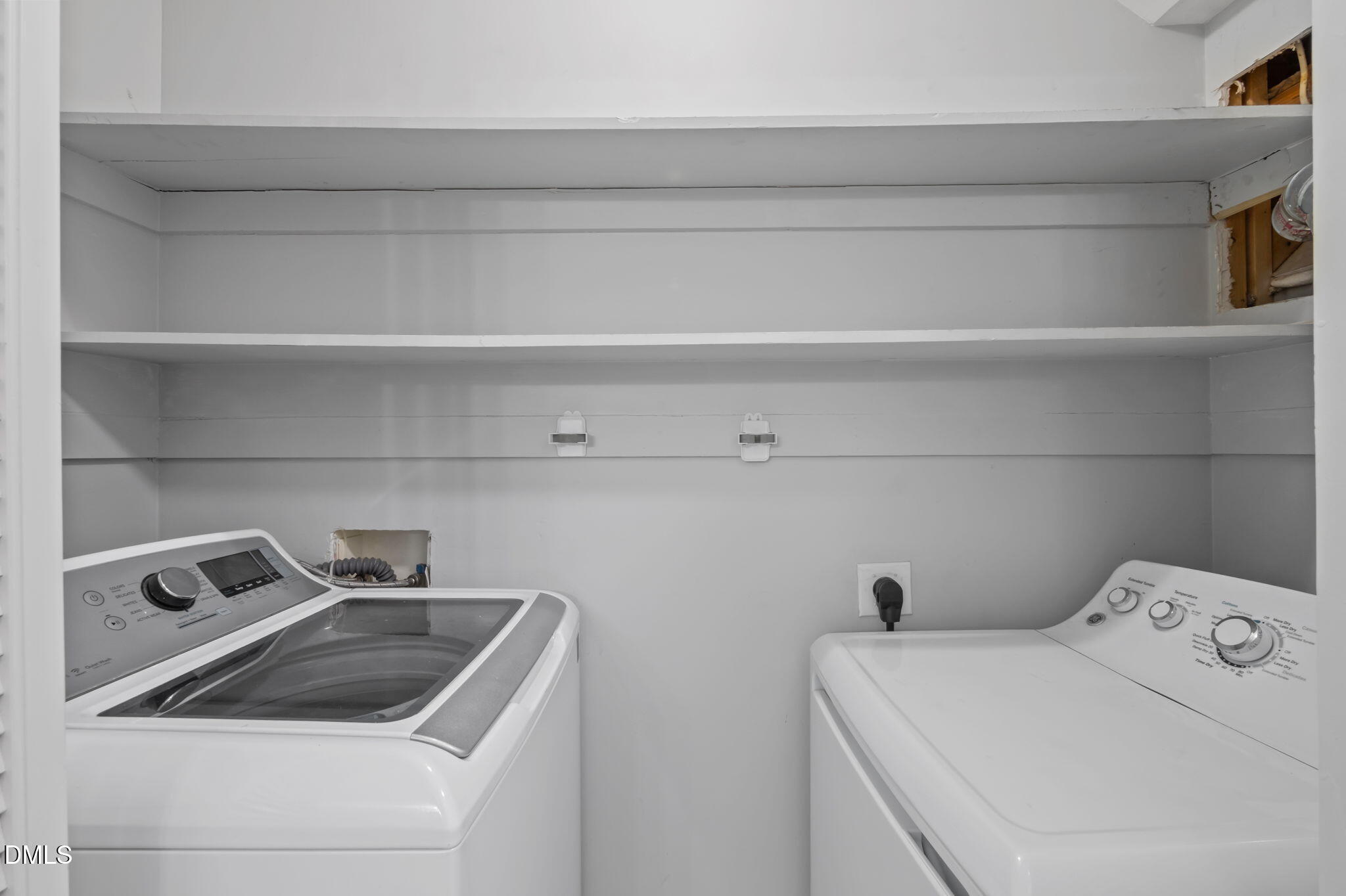 201 Simpson Street, Unit B Carrboro, NC 27510 - Photo 28 of 56 a view of storage and utility room with washer and dryer