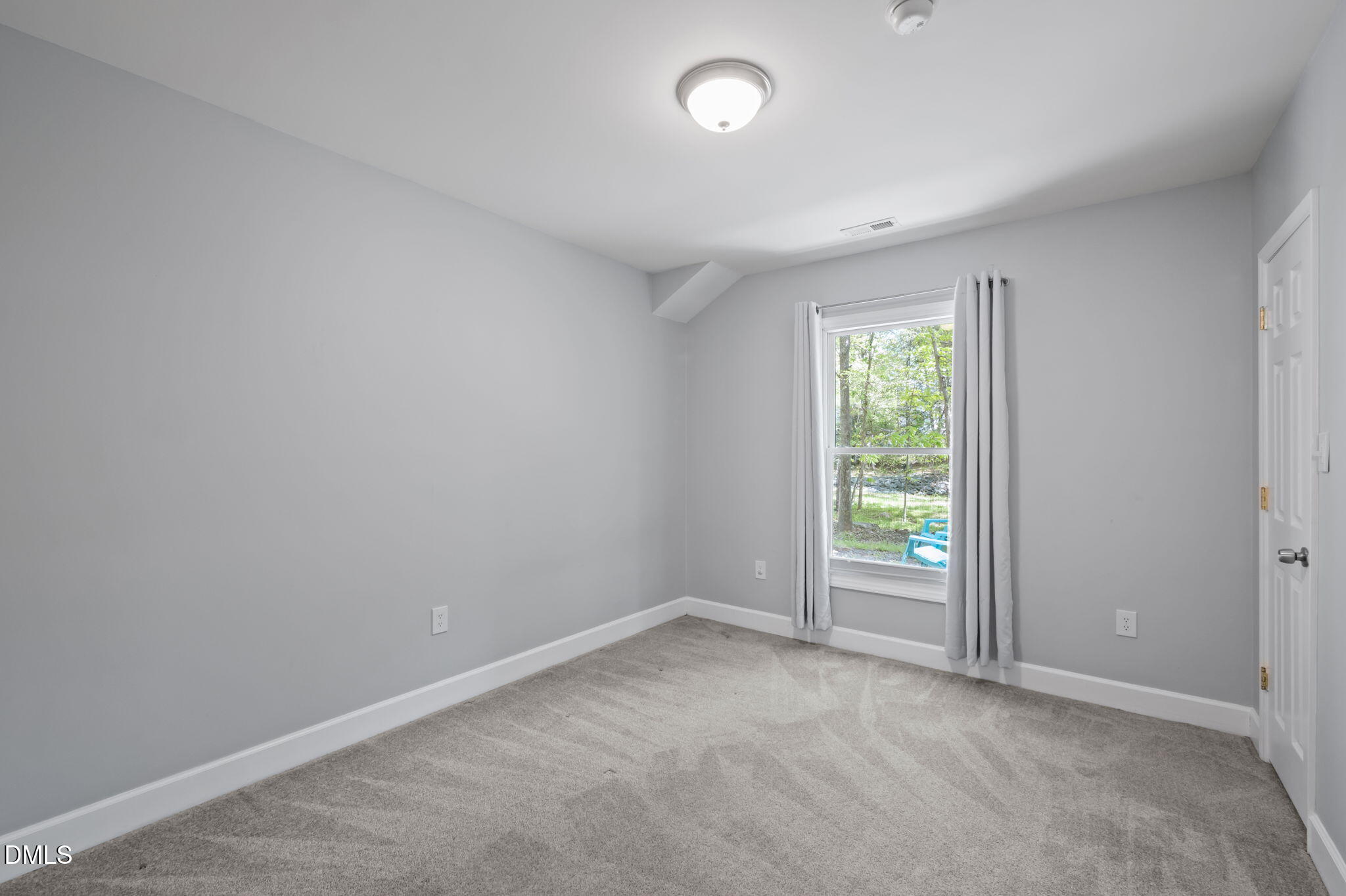 201 Simpson Street, Unit B Carrboro, NC 27510 - Photo 29 of 56 an empty room with windows