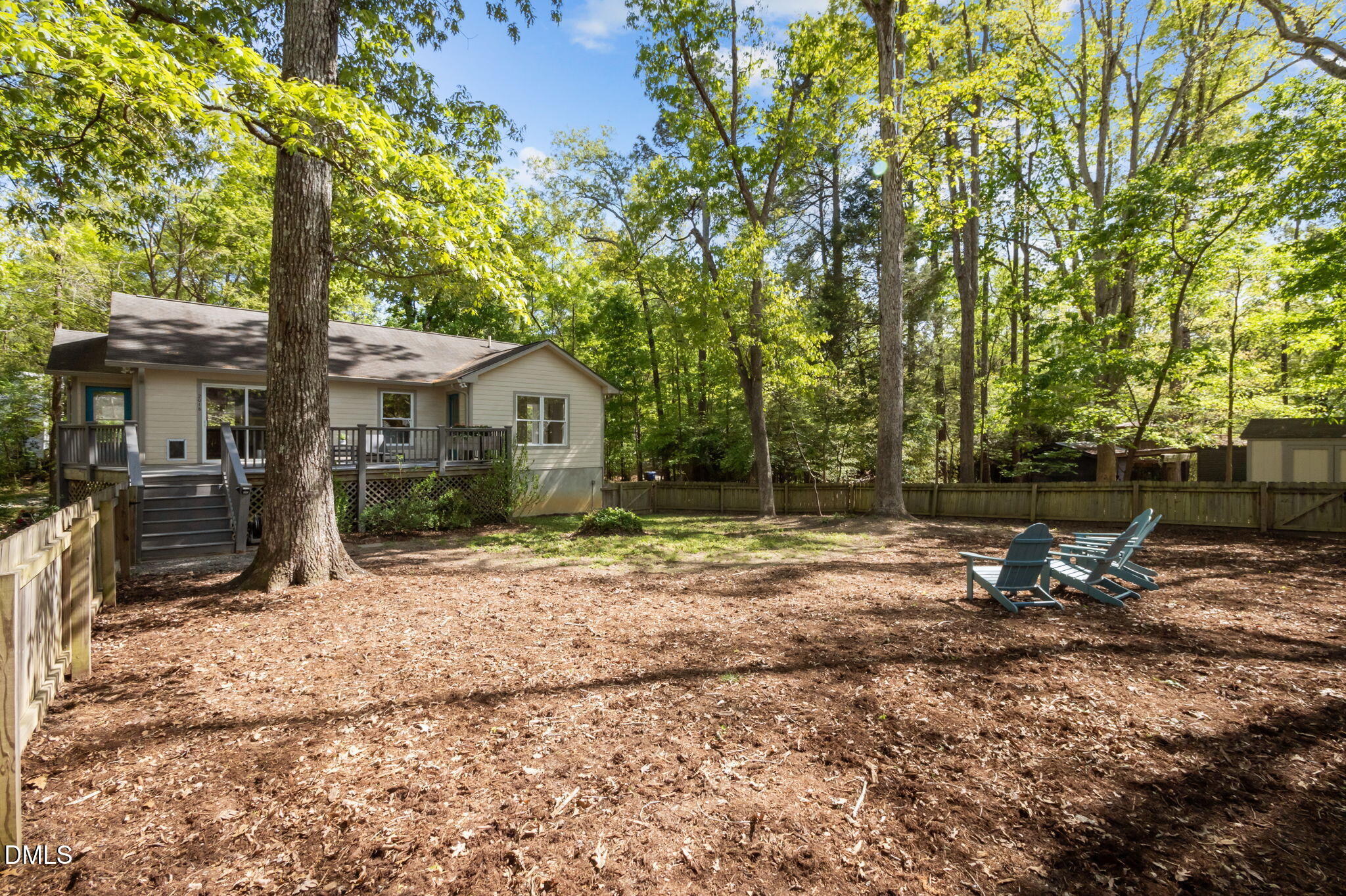 201 Simpson Street, Unit B Carrboro, NC 27510 - Photo 5 of 56 a backyard of a house with table and chairs
