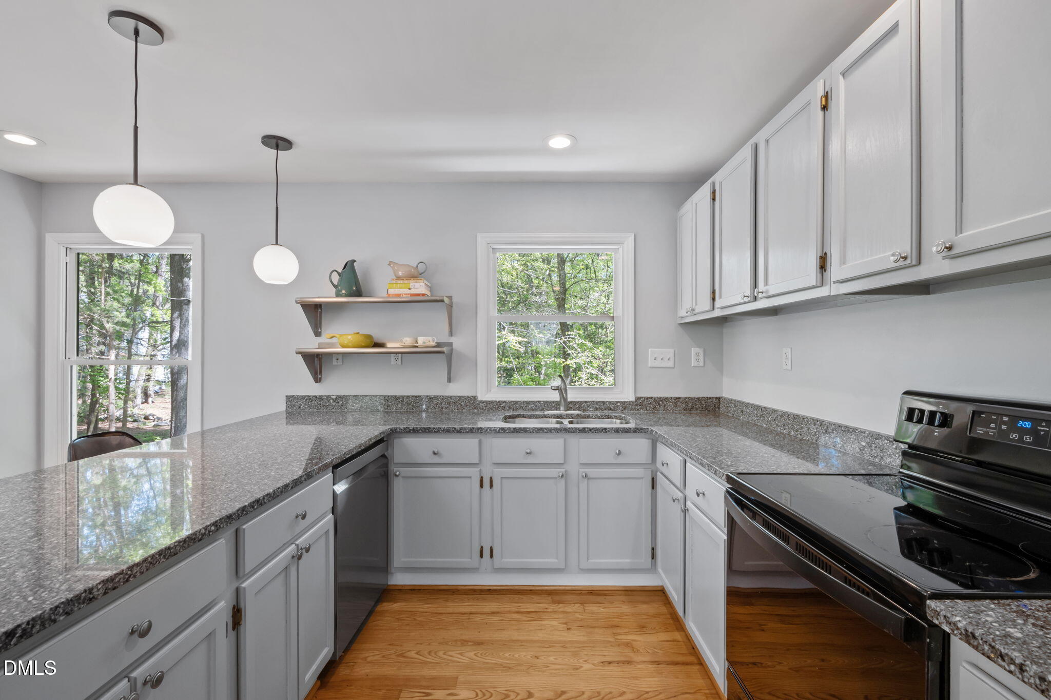 201 Simpson Street, Unit B Carrboro, NC 27510 - Photo 9 of 56 a kitchen with a sink stove and cabinets