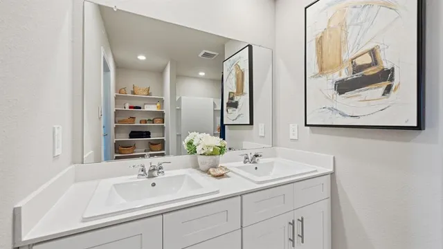 a bedroom with a bed and a chair