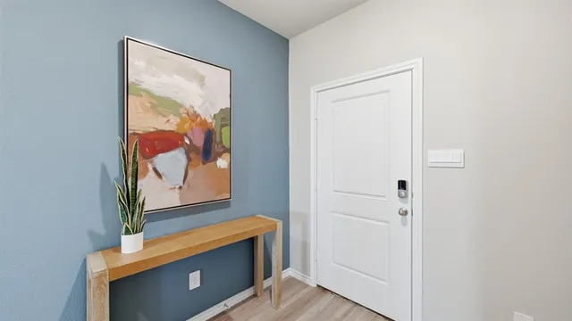 a bedroom with a bed and a table in it