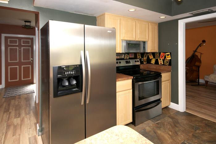 4881 Northwest 5th Terrace Boca Raton, FL 33431 - Photo 2 of 13 a kitchen with stainless steel appliances granite countertop a refrigerator and a sink