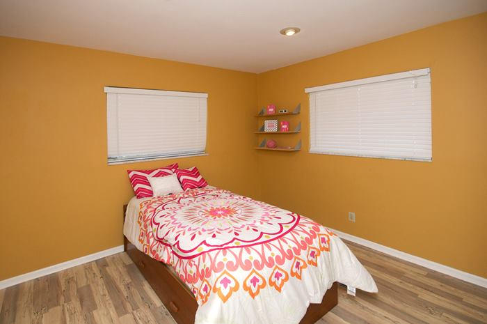 4881 Northwest 5th Terrace Boca Raton, FL 33431 - Photo 6 of 13 a bedroom with a bed and painting on the wall
