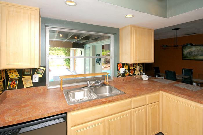 4881 Northwest 5th Terrace Boca Raton, FL 33431 - Photo 10 of 13 a kitchen with stainless steel appliances granite countertop a sink and a stove