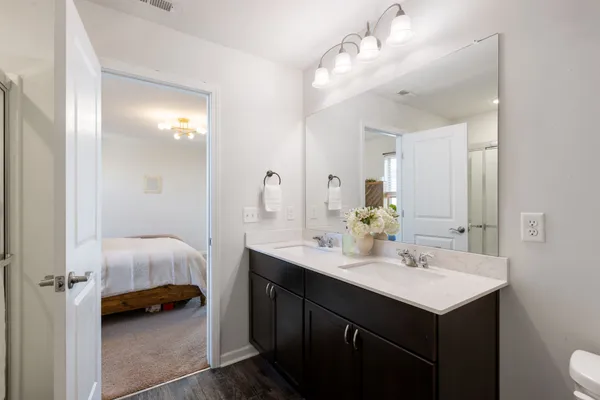 a en suite bathroom with a sink and a mirror