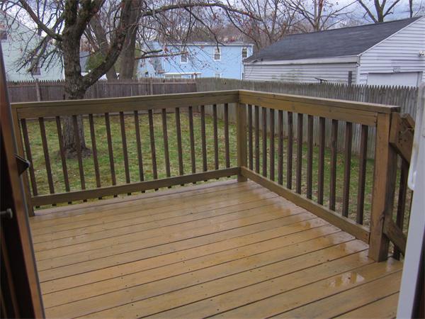 193 Wrentham Road Springfield, MA 01119 - Photo 4 of 12 a view of wooden balcony with a swing
