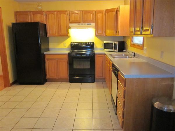 193 Wrentham Road Springfield, MA 01119 - Photo 8 of 12 a kitchen with stainless steel appliances a stove a refrigerator and a cabinets