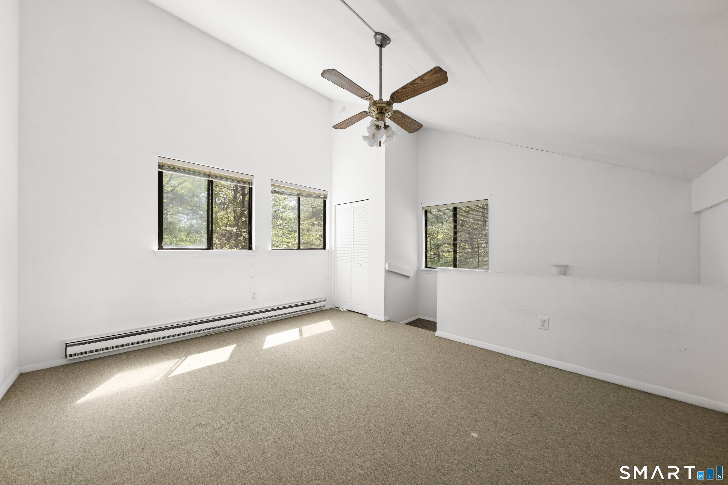 39 Evergreen Road, Unit 39 Torrington, CT 06790 - Photo 14 of 27 an empty room with windows and fan