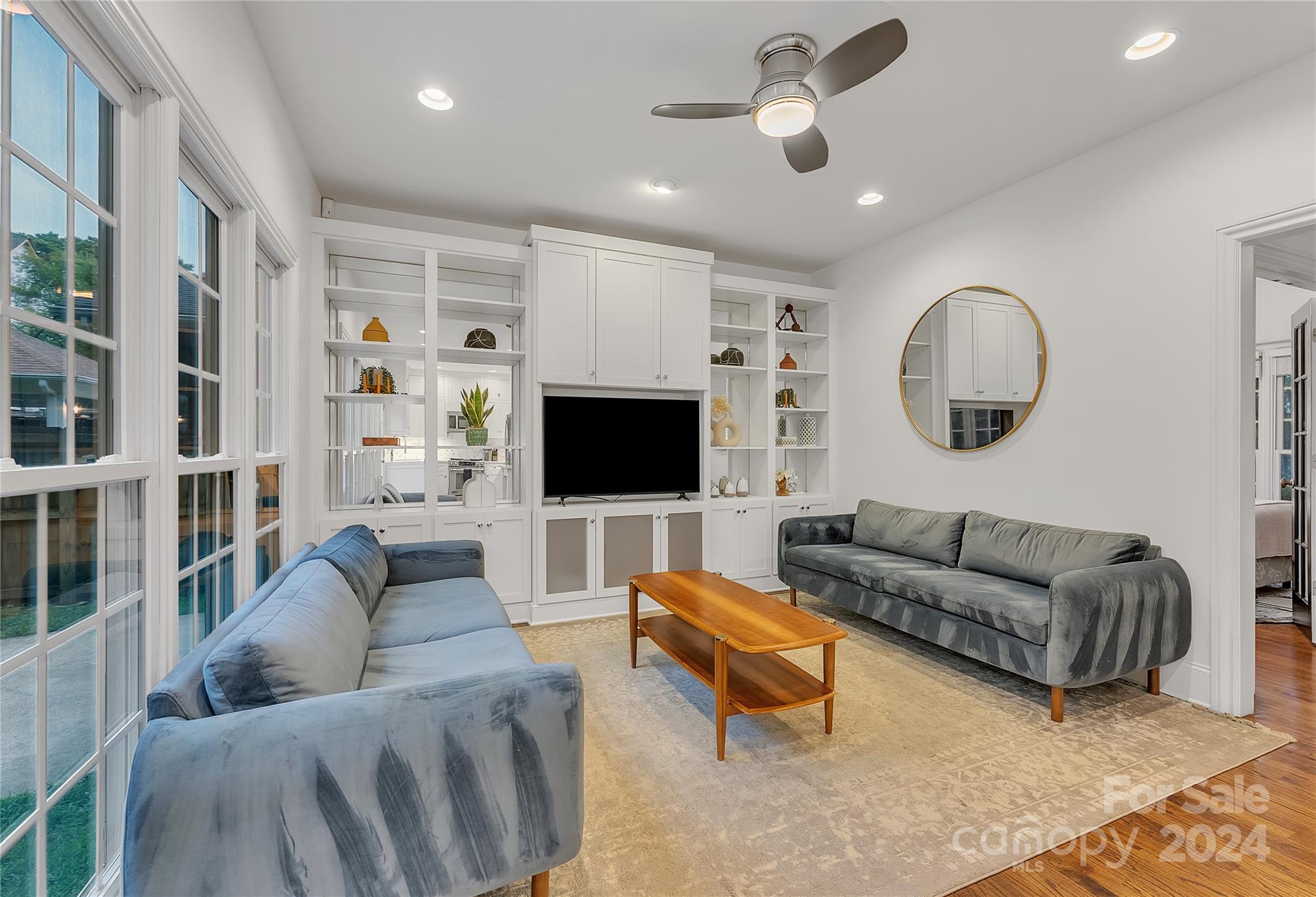 920 Millbrook Road Charlotte, NC 28211 - Photo 11 of 48 a living room with furniture and a flat screen tv