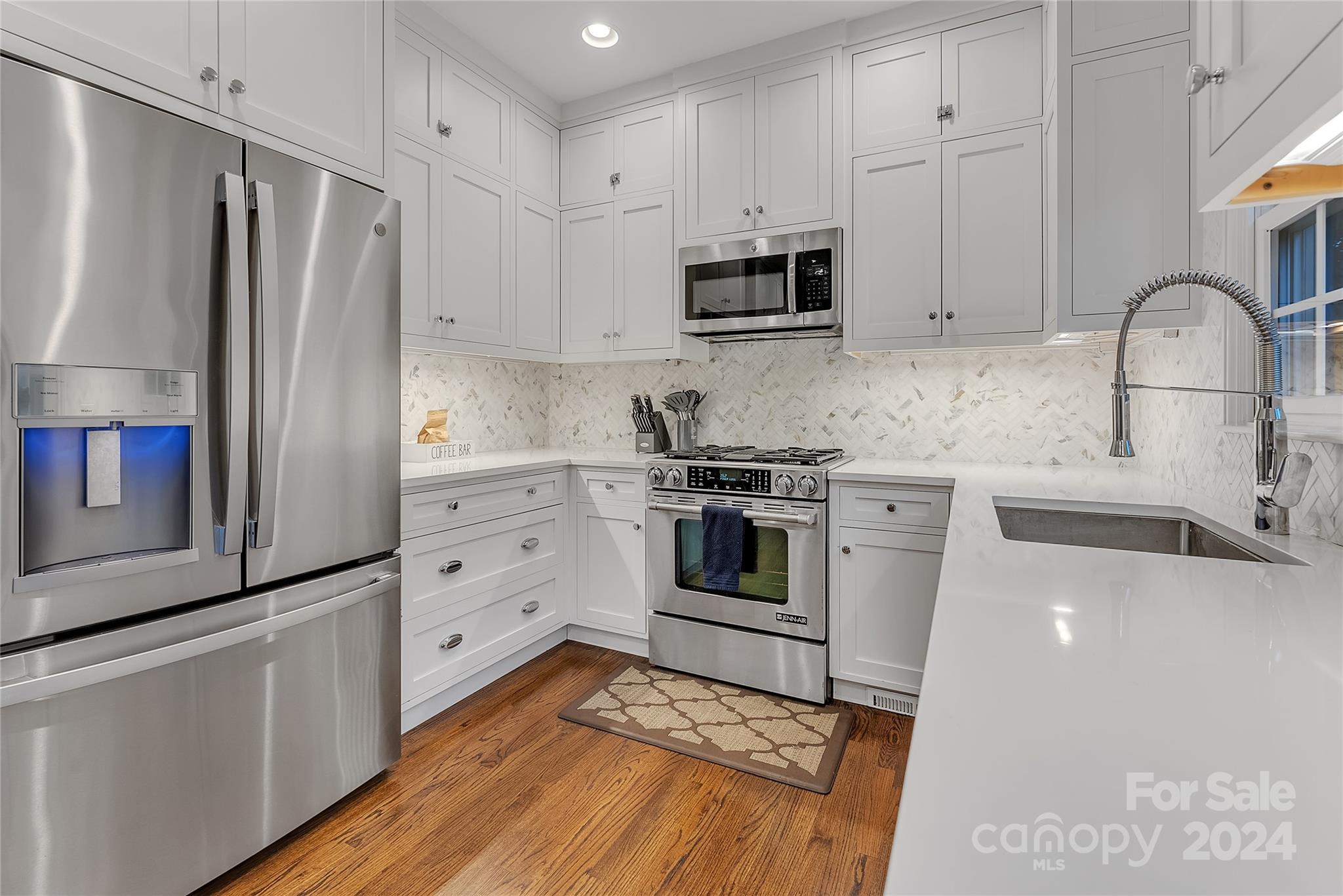 920 Millbrook Road Charlotte, NC 28211 - Photo 13 of 48 a kitchen with stainless steel appliances a refrigerator sink and microwave