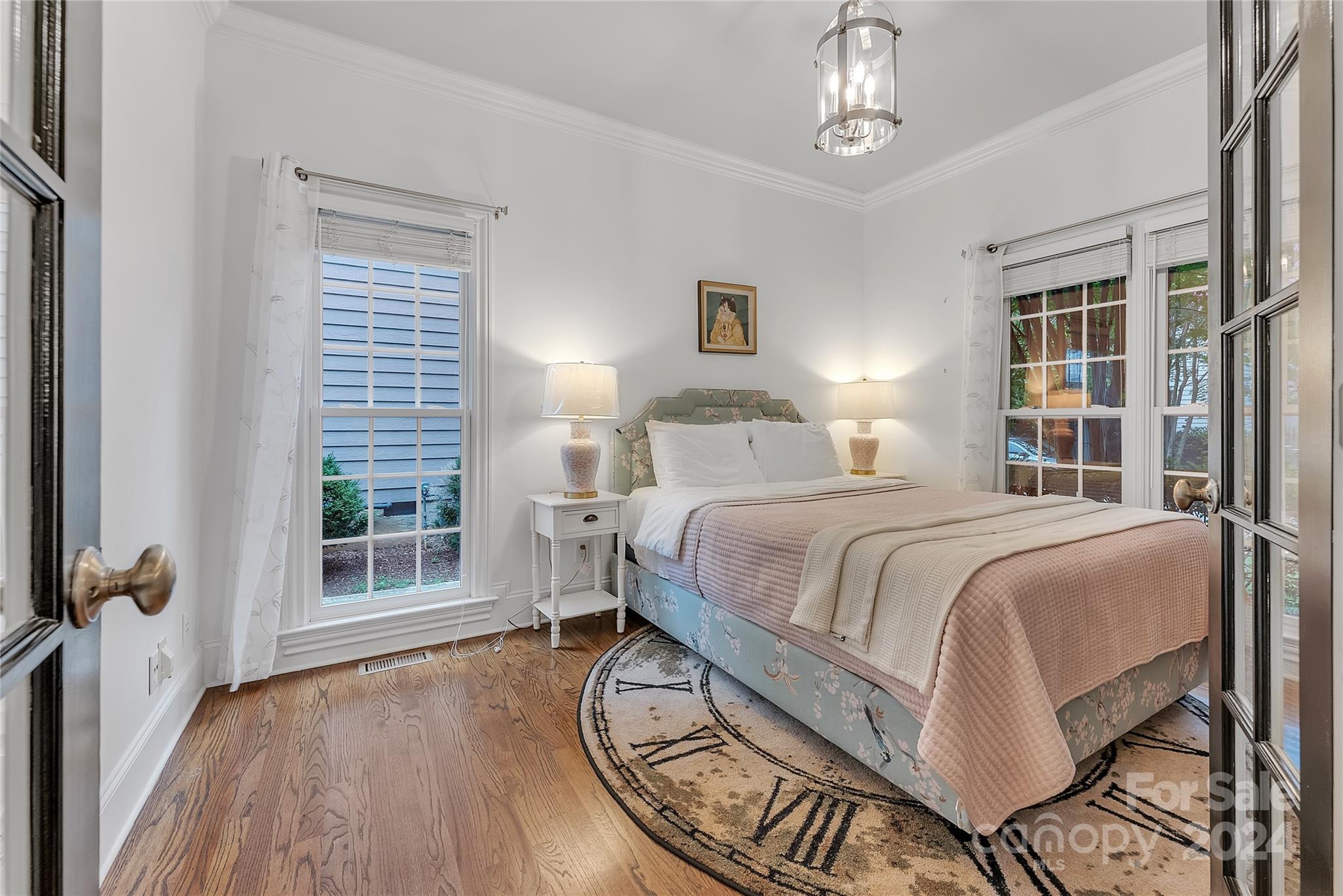 920 Millbrook Road Charlotte, NC 28211 - Photo 19 of 48 a bedroom with a bed wooden floor and window