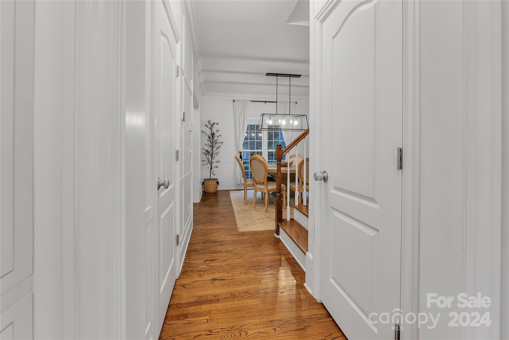 920 Millbrook Road Charlotte, NC 28211 - Photo 22 of 48 a hallway with wooden floor and stairs