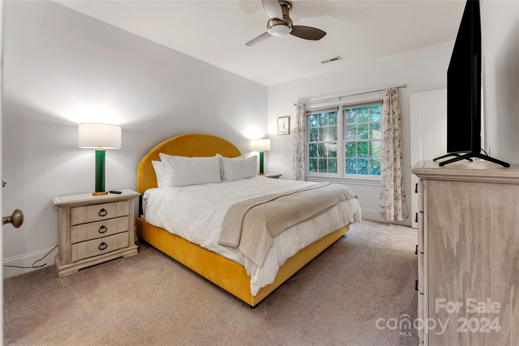 920 Millbrook Road Charlotte, NC 28211 - Photo 25 of 48 a bedroom with a bed and a flat tv screen